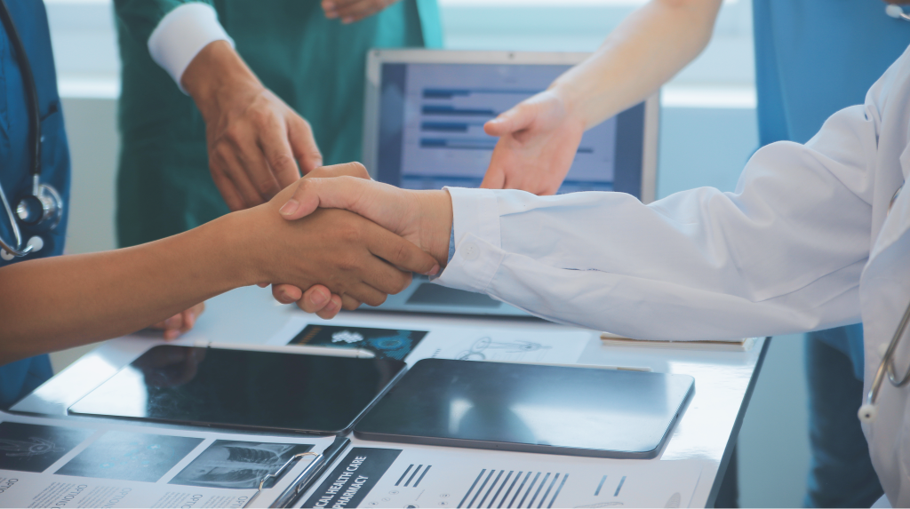 Medical teams shaking hands on a partnership